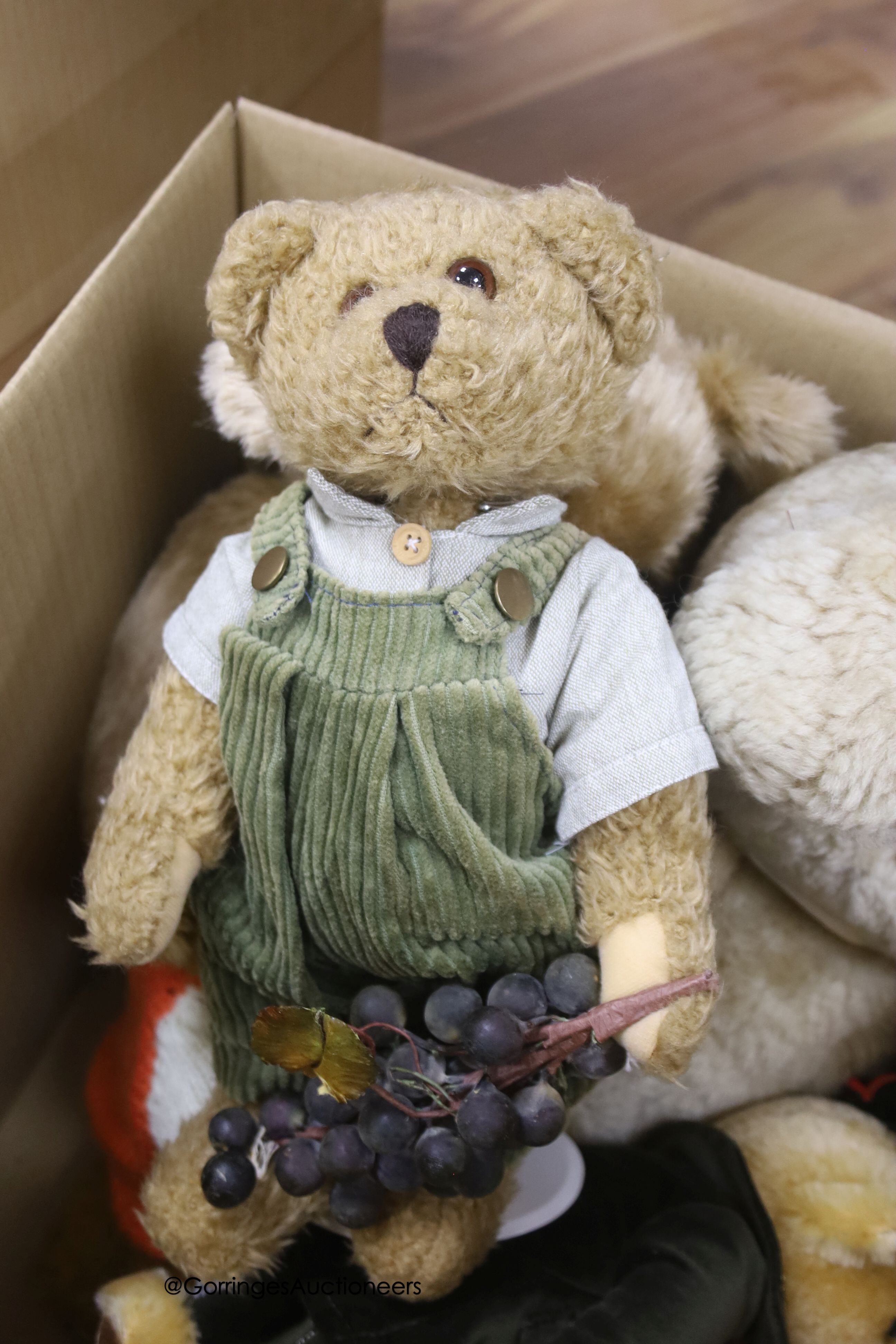 A large vintage sheepskin bear in perfect condition, with three Harrods bears and a Deans limited edition, a Deans 